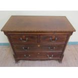 An early 19c mahogany chest of two short and two long drawers together with a slide, within canted