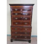 A George III mahogany chest on chest, the upper section having two short and three long graduated