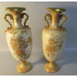 A pair of early 20c Carltonware peony vases decorated on a blush ivory ground with gilt