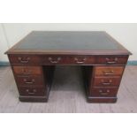 An early 19c mahogany partners desk of rectangular form with moulded edge and having green leather