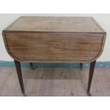 A late Georgian mahogany Pembroke table, flaps with rounded corners, ebony line inlaid and having