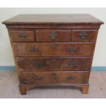 A mid 18c oak chest of three short and three long graduated drawers on bracket feet, 100cm w,