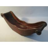 A late Georgian mahogany cheese coaster of cradle form and being of small proportion, 32cm l, 9cm w.