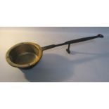 An early 18c brass and iron skillet pan, the wrought iron handle with scrolling support, pan 22cm