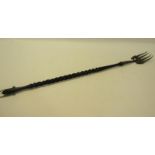 An Edwardian toasting fork with silver prongs and twist form whale bone handle, makers mark for