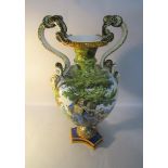 A large 20c Richard Ginori renaissance style Majolica vase with masked serpent handles and hand