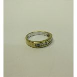 An 18ct gold Diamond set half eternity ring - ring size P.