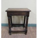 An oak joint stool, the top of rectangular form with moulded edge on plain frieze with ring turned