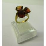 An 18ct gold cut Garnet three stone set ring.