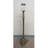 A late Victorian brass oil lamp stand with electrical fittings with adjustable reeded column on a