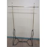 A 19c brass and steel clothes rail of adjustable height. 132cms w x 193h.