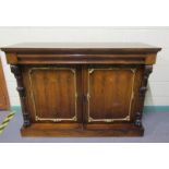 A Victorian rosewood side cabinet of rectangular form, cross banded and with brass rail inlay.