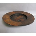 A 19c rosewood alms dish of circular dish form with cruciform centre. 40cms dia.