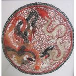 A Vietnamese buffalo hide of circular form depicting a dragon and a mythical bird with gilt