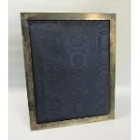 An Edwardian silver cased photo frame of plain form, London 1909, 31cms x 38.5cms.