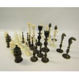 A 19c Indian ivory and horn chess set, the Kings 9cms high - contained in a sandalwood lined box,