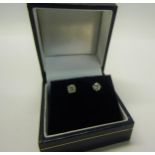 An 18ct gold diamond stud earrings, approx 1/2 carat total.