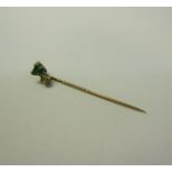 A gold Emerald and Diamond set stick pin, 5.5cms l.