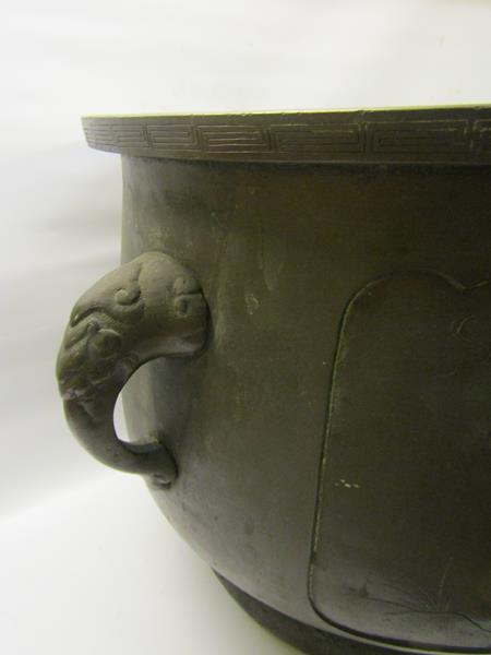 A 19c Oriental patinated bronze jardinere of bulbous form with Elephant trunk side handles and - Image 3 of 8