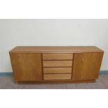 A Nordic furniture teak sideboard fitted four central drawers by two shelved cupboards enclosed by