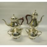 A four piece silver tea and coffee service of baluster form, the teapot and coffee pot with hinged