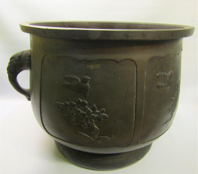 A 19c Oriental patinated bronze jardinere of bulbous form with Elephant trunk side handles and - Image 7 of 8