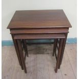 A nest of three Litton Furniture teak occasional tables of square form, the largest 49cms w x