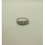 A platinum art deco style five stone Diamond set ring - size N