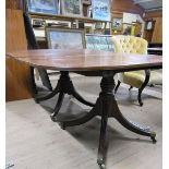 A late Georgian style D end dining table with reeded edge, on two columns each with four splayed