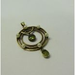 A gold Seed Pearl and Peridot set pendant, 2.5cms dia.