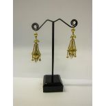 A pair of early 20c Continental high carat gold earrings with tassel orb shaped pendants. 4.6g.