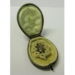 A Victorian memoriam seed pearl brooch with locket of hair insert.