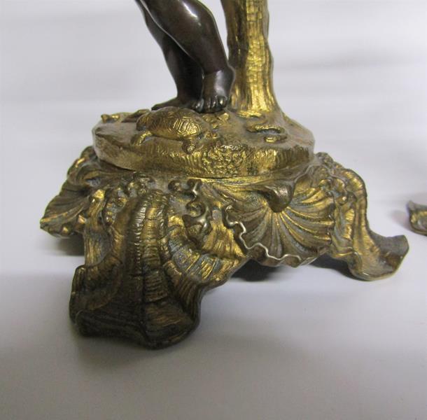 A pair of late 19c gilt and patinated bronze candlesticks with putti columns supporting the socles - Image 4 of 5