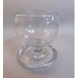 A late 19c clear glass Tavern Salt on a short stem with a heavy circular base. 11cms h.