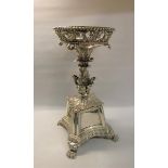 A George III silver table centrepiece, the upper circular beaded and scrolling leaf pierced basket
