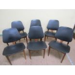 A set of six Eon teak and plywood single chairs with black vinyl upholstered backs and seats.