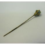 A gold orb stick pin with Turquoise bead decoration. 8cms l.