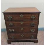 A late Georgian mahogany chest of four long drawers with cut brass back plates and swing handles. On