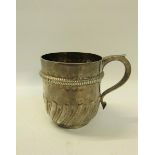 A late Victorian silver tankard, half rise and lobed with an upper gadroon embossed band with