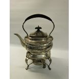 A silver tea kettle on stand with burner, makers mark for Thomas Edward Atkins, Birmingham 1913.