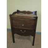 A George III mahogany tray top bedroom commode with a cupboard enclosed by a hinged lift up door