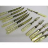 A set of six Edwardian pearl handled silver fruit knives and forks, manufacturers James Dixon &