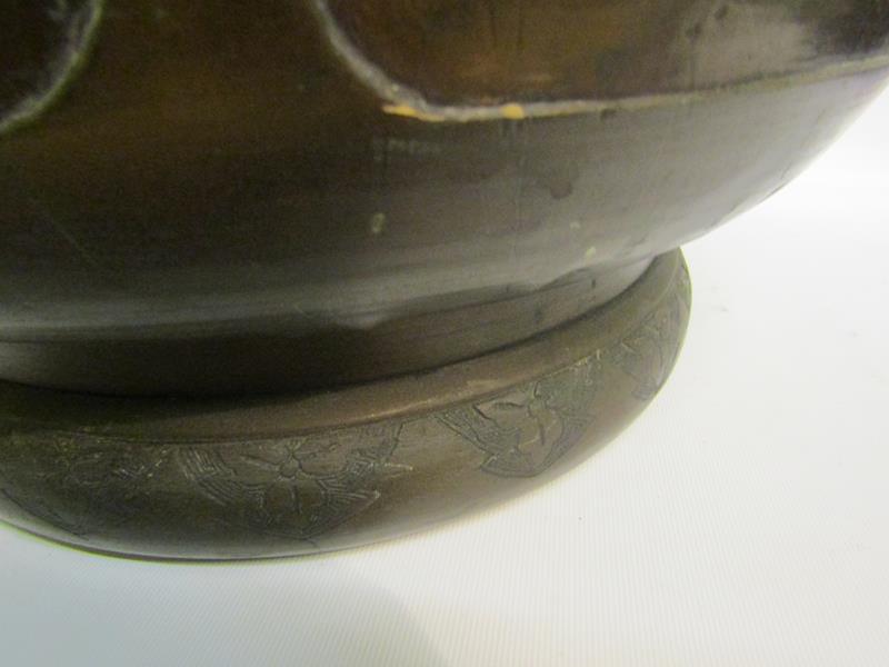 A 19c Oriental patinated bronze jardinere of bulbous form with Elephant trunk side handles and - Image 8 of 8