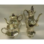 A mid Victorian silver four piece tea and coffee service of chased facet baluster form, the coffee