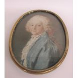 Early 19c portrait watercolour miniature of a young gentleman with ribbon in his hair. Oval framed