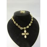 A gilt metal yellow Beryl set necklace with pendant cross, together with a brooch. Necklace 36cms l.