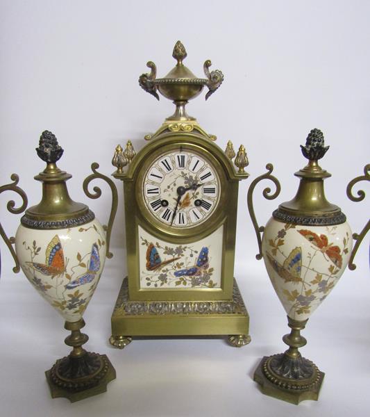 Late 19c French Garniture de Cheminée comprising a clock and two urns. The clock has a rectangular