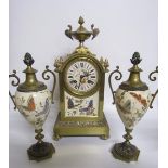 Late 19c French Garniture de Cheminée comprising a clock and two urns. The clock has a rectangular
