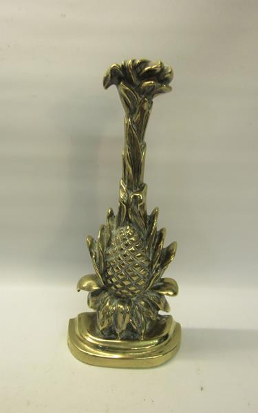 A 19c brass and iron door stop in the form of a pineapple. 34cms h.