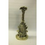 A 19c brass and iron door stop in the form of a pineapple. 34cms h.